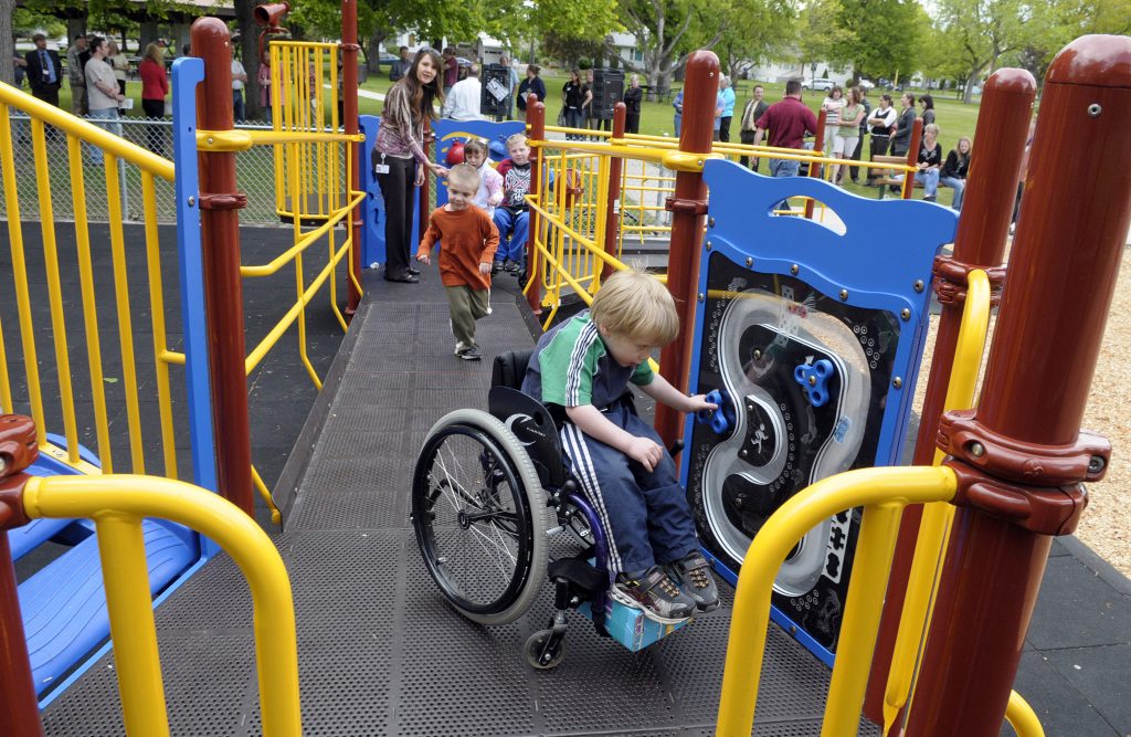 Caleb Ross is one of the first kids to use the new playground at Mission Park Tuesday May 25, 2010. The equipment is accessible for children in wheelchairs and walkers and features a rubberized tile ground cover. CHRISTOPHER ANDERSON chrisa@spokesman.com